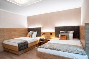 Cama ou camas em um quarto em Villa Westend Hotel an der Messe