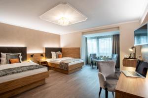 Cama ou camas em um quarto em Villa Westend Hotel an der Messe