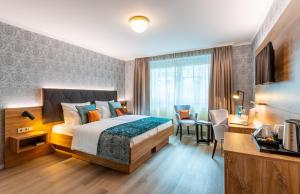 Cama ou camas em um quarto em Villa Westend Hotel an der Messe