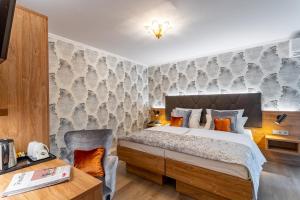 Cama ou camas em um quarto em Villa Westend Hotel an der Messe