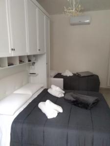 Posteľ alebo postele v izbe v ubytovaní La Casa di Ludovica all'Appio Latino