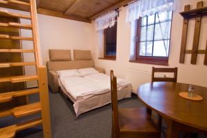Postel nebo postele na pokoji v ubytování Apartmány Udatný