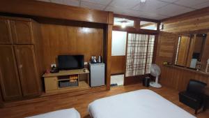 Letto o letti in una camera di 四重溪洺泉溫泉旅館
