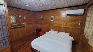 Letto o letti in una camera di 四重溪洺泉溫泉旅館