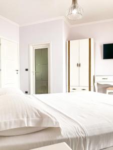 Säng eller sängar i ett rum på Hotel Majestic