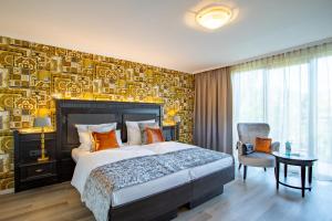 Cama ou camas em um quarto em Villa Westend Hotel an der Messe
