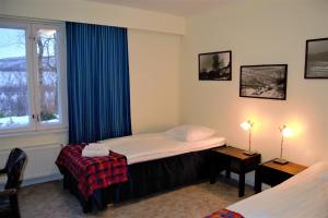 Postel nebo postele na pokoji v ubytování Hotel Utsjoki