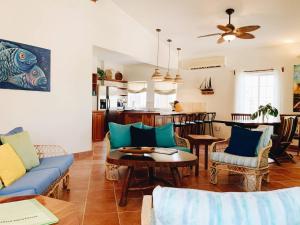 a living room with a couch and a table at Caye Casa in San Pedro