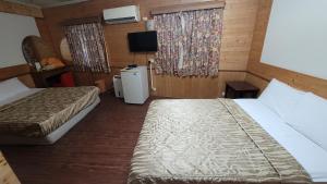 Letto o letti in una camera di 四重溪洺泉溫泉旅館