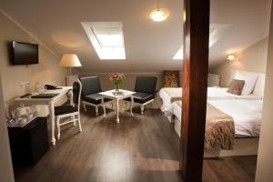 Łóżko lub łóżka w pokoju w obiekcie Leone Aparthotel