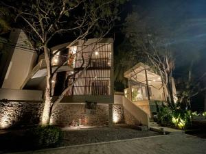 a building with a staircase at night at La Bohème Sayulita in Sayulita
