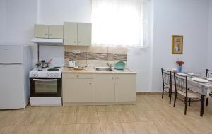 A kitchen or kitchenette at HAROULENA