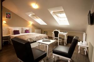 Łóżko lub łóżka w pokoju w obiekcie Leone Aparthotel