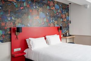 Ένα ή περισσότερα κρεβάτια σε δωμάτιο στο Hôtel 31 - Paris Tour Eiffel