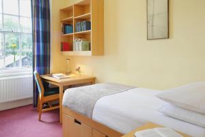 เตียงในห้องที่ Trinity College - Campus Accommodation