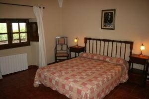 
A bed or beds in a room at Casa Rural Las Canteras
