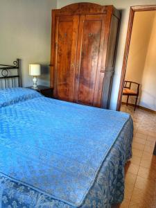 Ένα ή περισσότερα κρεβάτια σε δωμάτιο στο AL CORNIOLO