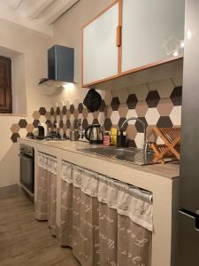 a kitchen with a counter with towels on it at Pienzalettings in Pienza