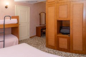 A bed or beds in a room at Hotel Terrazzo d'Abruzzo