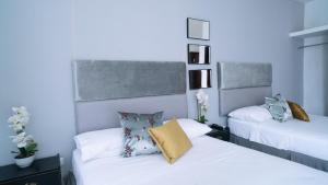 Postel nebo postele na pokoji v ubytování Hotel Boutique Casa Umiña