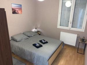 Postel nebo postele na pokoji v ubytování Appartement familiale et conviviale 2 chambres à Montlucon - 250m hopital
