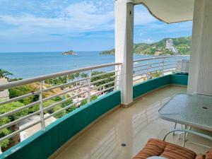 a balcony with a view of the ocean at Apartamentos con vista al mar Brisa Marina Rodadero - by Bedviajes in Santa Marta