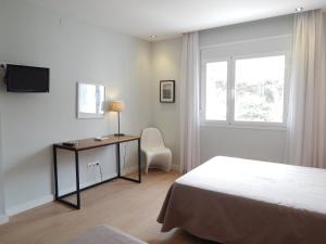 Postel nebo postele na pokoji v ubytování Hostal Las Cumbres + 37 fotografií