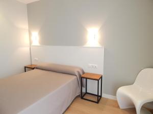 Postel nebo postele na pokoji v ubytování Hostal Las Cumbres