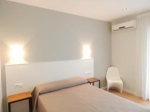 Postel nebo postele na pokoji v ubytování Hostal Las Cumbres