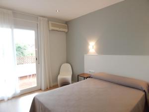 Postel nebo postele na pokoji v ubytování Hostal Las Cumbres