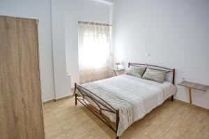 Postel nebo postele na pokoji v ubytování HAROULENA