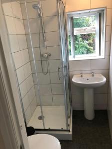 a bathroom with a shower and a sink at SPITTAL BROOK in Stafford