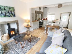 a living room with a couch and a fireplace at Evergreen in Ilkley