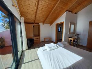 a bedroom with a large white bed in a room at Villa Luz II - NEW - Private Outdoor Area in Santa Cruz