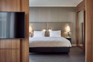 Postel nebo postele na pokoji v ubytování Radisson Blu Hotel Hannover