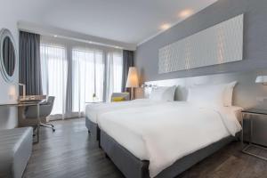 Postel nebo postele na pokoji v ubytování Radisson Blu Hotel Hannover