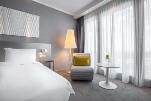 Postel nebo postele na pokoji v ubytování Radisson Blu Hotel Hannover