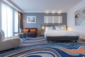 Postel nebo postele na pokoji v ubytování Radisson Blu Hotel Hannover