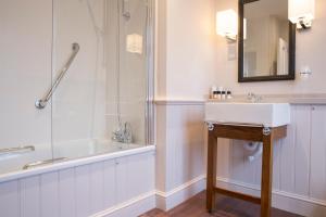 a bathroom with a sink and a shower at The Marine in Whitstable