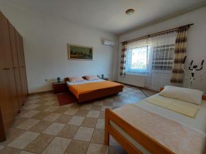 Posteľ alebo postele v izbe v ubytovaní Apartments Bernarda