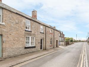 an empty street in an old stone house at Fisherman's Cottage in Seahouses