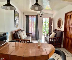 a living room with a table and chairs at Sweet Home Carrión in Fortuna
