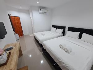 Postel nebo postele na pokoji v ubytování Vamin Resort Chiangkhan Loei วามินทร์รีสอร์ท เชียงคาน เลย