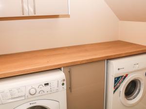a laundry room with a washer and dryer at Providence Apartment in Epworth