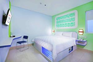 Postel nebo postele na pokoji v ubytování Cordex Hotel Ancol + 21 fotografií