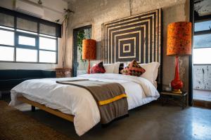 Postel nebo postele na pokoji v ubytování Hotel Boutique Lafayette Tijuana