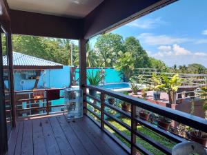 A balcony or terrace at Island samal overlooking view house with swimming pools