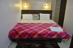 Postel nebo postele na pokoji v ubytování Hotel Kanha Inn