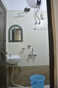 a bathroom with a sink and a mirror at Hotel Kanha Inn in Lucknow