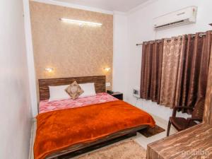 Postel nebo postele na pokoji v ubytování Hotel Kanha Inn